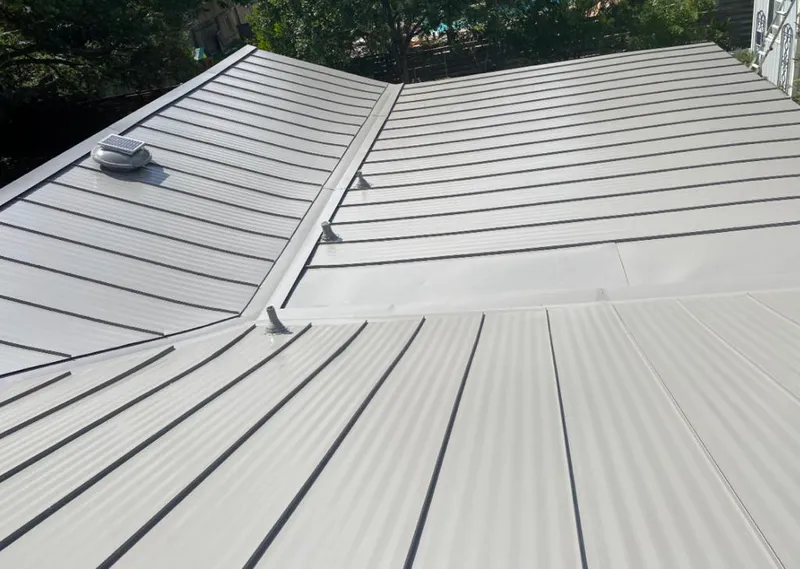 Solar attic fan installed on a metal roof for Roof Ventilation in Wentzville